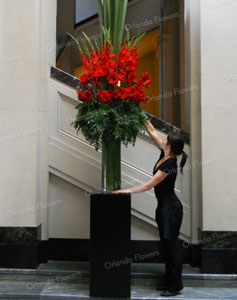 Sophie creating Amaryllis and Flax Vase - Red Carpet Event - Auckland Museum